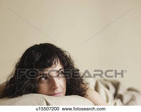 Woman in bed thinking View Large Photo Image Stock Image - Woman in bed thinking. Fotosearch