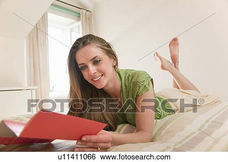 Woman in hotel room View Large Photo Image Stock Photograph - Woman in hotel room. Fotosearch