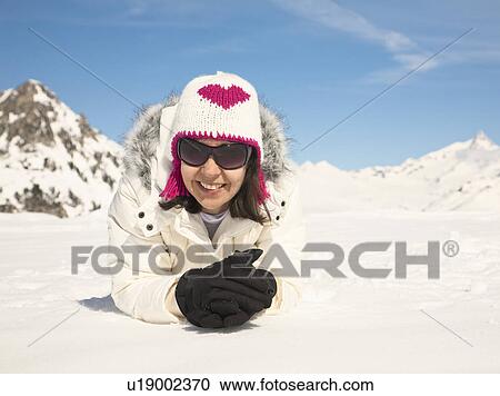 Stock Image - Woman in snow. Fotosearch
