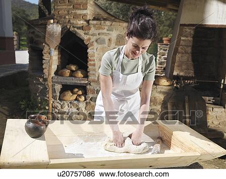 Woman kneading bread dough View Large Photo Image Stock Photograph - Woman kneading bread dough. Fotosearch