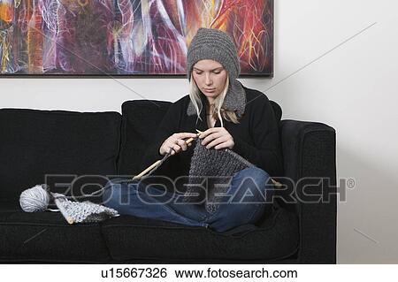 Stock Photograph - Woman knitting scarf. Fotosearch