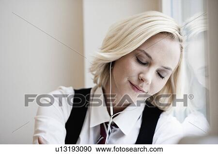 Woman listening music View Large Photo Image Stock Image - Woman listening music. Fotosearch