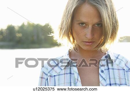 Stock Photography - Woman looking at camera. Fotosearch
