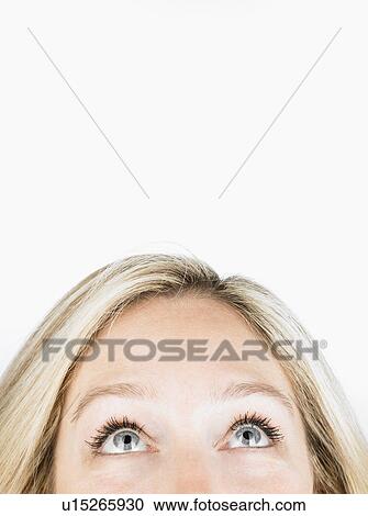 Woman looking up to free space View Large Photo Image Stock Image - Woman looking up to free space. Fotosearch