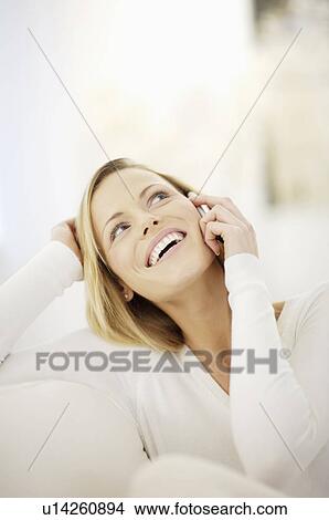 Picture - woman making a phone call. Fotosearch