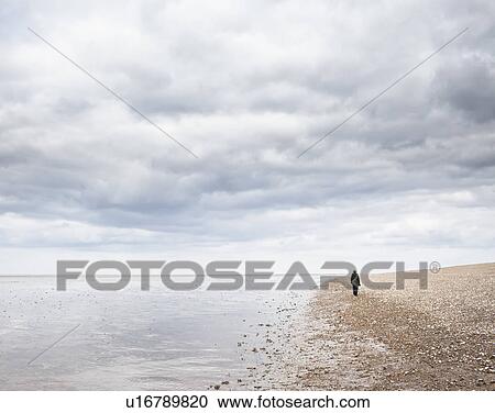 Stock Image - Woman on beach. Fotosearch