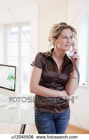 Stock Photograph - Woman on the phone. Fotosearch