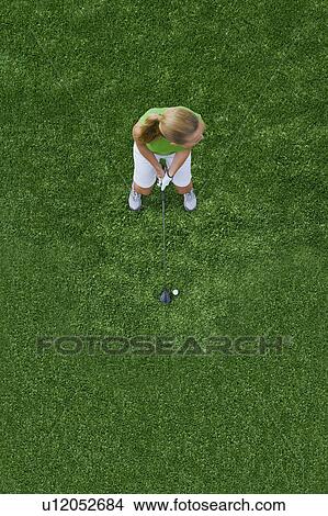 Woman playing golf View Large Photo Image Picture - Woman playing golf. Fotosearch