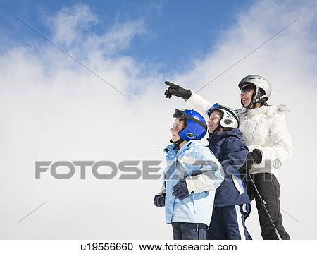 Woman pointing with two boys View Large Photo Image Stock Image - Woman pointing with two boys. Fotosearch