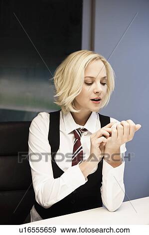 Woman polishing nails View Large Photo Image Stock Photo - Woman polishing nails. Fotosearch