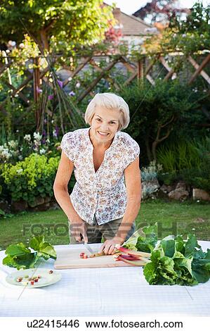 woman preparing rhubarb. View Large Photo Image Stock Photograph - woman preparing rhubarb.. Fotosearch