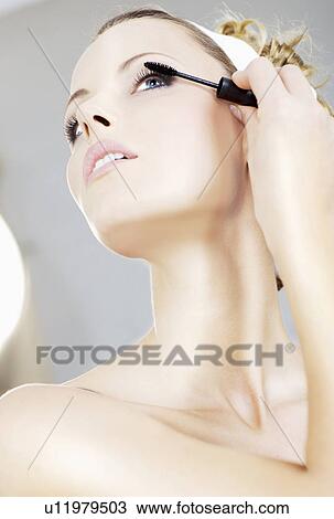 woman putting her face on View Large Photo Image Stock Image - woman putting her face on. Fotosearch