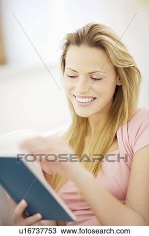Stock Image - woman reading a book. Fotosearch