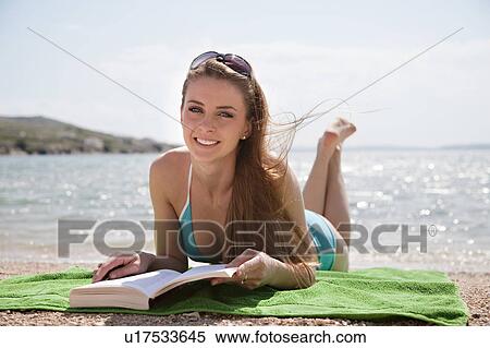 Woman reading at the beach View Large Photo Image Stock Photography - Woman reading at the beach. Fotosearch