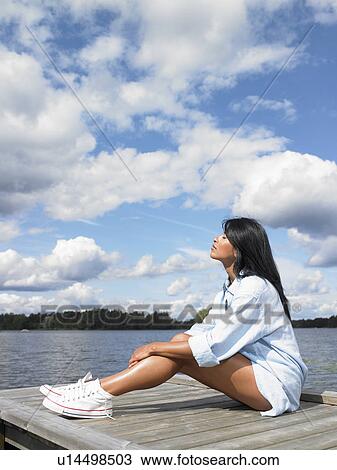 Stock Image - Woman reconnecting with nature. Fotosearch