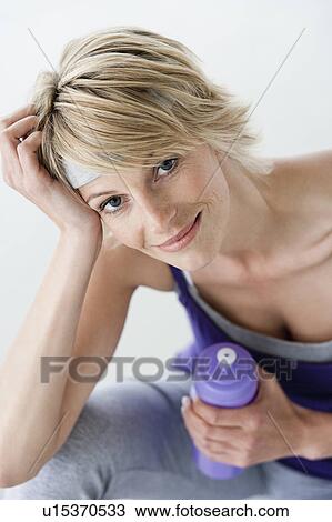 Stock Image - Woman resting after sports portrait. Fotosearch