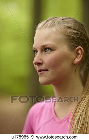 Stock Photo - Woman running, standing, close-up. Fotosearch