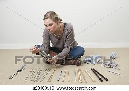 Stock Photo - Woman selecting knitting needles. Fotosearch