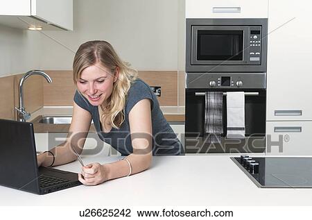 Woman shopping on line View Large Photo Image Stock Image - Woman shopping on line. Fotosearch