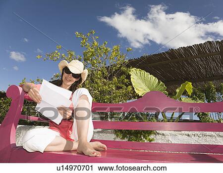 Woman Sitting reading letter View Large Photo Image Stock Image - Woman Sitting reading letter. Fotosearch
