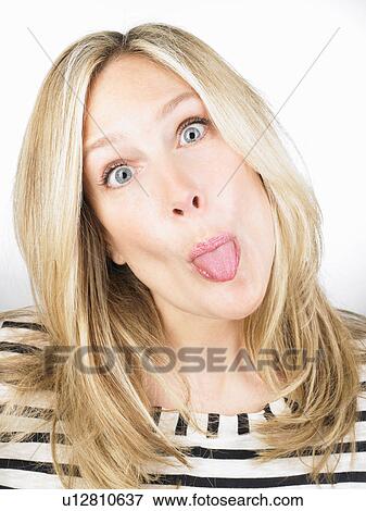 Stock Photo - Woman sticking out her tongue. Fotosearch