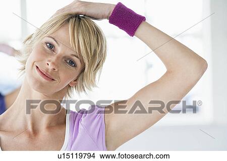 Picture - Woman stretching neck. Fotosearch