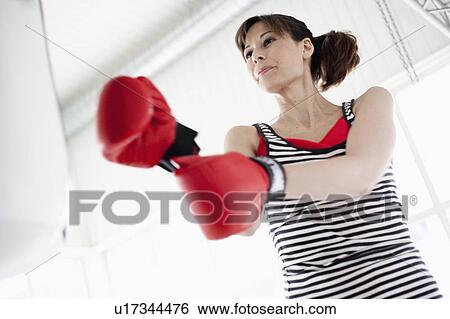 Woman trying out boxing View Large Photo Image Stock Photograph - Woman trying out boxing. Fotosearch