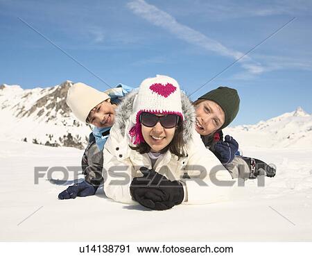 Woman & two boys in snow View Large Photo Image Stock Image - Woman & two boys in snow. Fotosearch