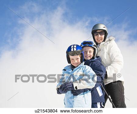 Woman & Two Boys wearing skis View Large Photo Image Picture - Woman & Two Boys wearing skis. Fotosearch