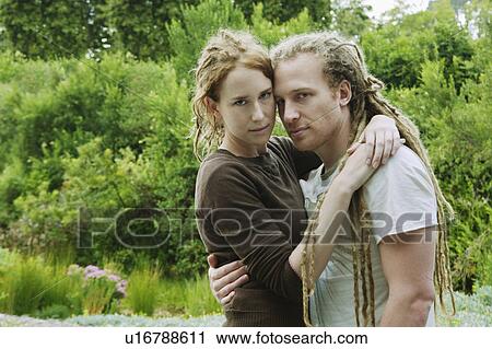 Woman with arms around man View Large Photo Image Stock Image - Woman with arms around man. Fotosearch