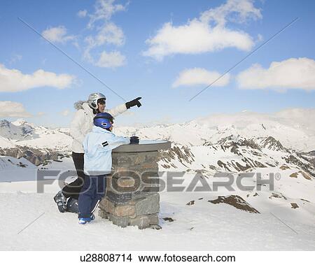 Woman with boy in snowy mountain scene View Large Photo Image Picture - Woman with boy in snowy mountain scene. Fotosearch