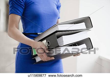 Woman with files View Large Photo Image Stock Photo - Woman with files. Fotosearch