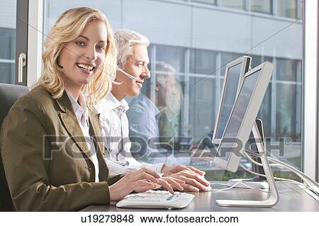 Woman with headset smiling to camera View Large Photo Image Stock Photo - Woman with headset smiling to camera. Fotosearch