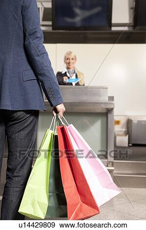 Woman with shopping bags traveling View Large Photo Image Stock Photo - Woman with shopping bags traveling. Fotosearch