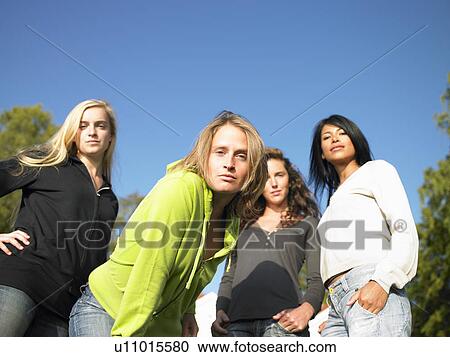 Stock Image - Women looking seriously at camera. Fotosearch