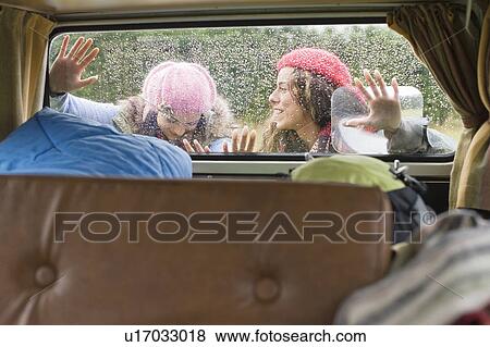 Women pushing camper van View Large Photo Image Stock Photo - Women pushing camper van. Fotosearch