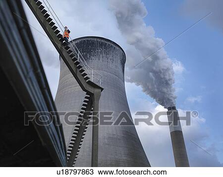 Stock Image - Worker At Coal Fired Power Station. Fotosearch