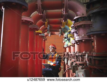 Worker In Coal Fired Power station View Large Photo Image Stock Photo - Worker In Coal Fired Power station. Fotosearch