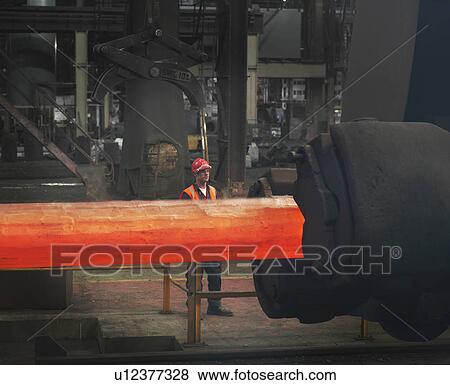 Stock Photo - Worker With Steel Forge. Fotosearch