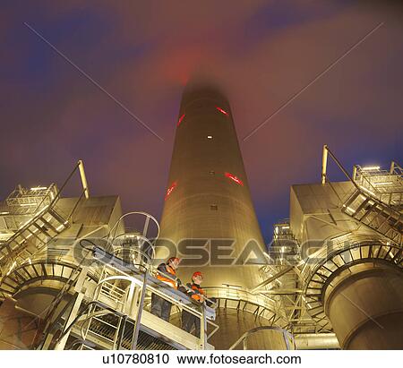 Stock Image - Workers And Coal Fired Power Station. Fotosearch