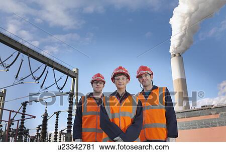 Stock Image - Workers At Coal Fired Power Station. Fotosearch