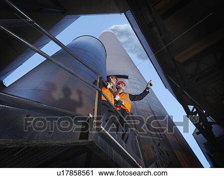 Stock Image - Workers At Coal Fired Powerstation. Fotosearch