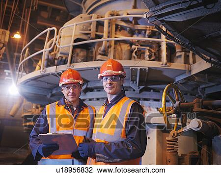 Stock Image - Workers In Coal Fired Power Station. Fotosearch