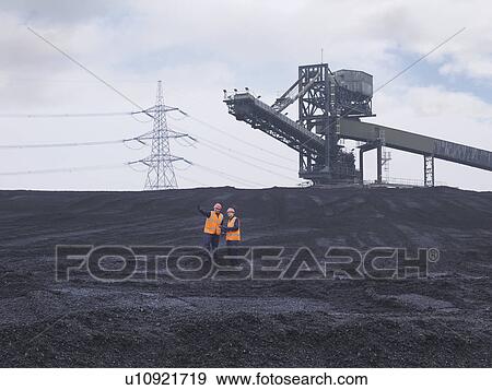 Stock Photo - Workers Inspecting Coal Store. Fotosearch