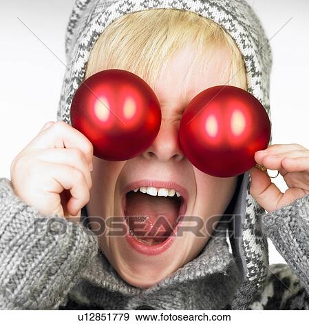 xmas decoration in front of boy's eyes View Large Photo Image Stock Photo - xmas decoration in front of boy's eyes. Fotosearch