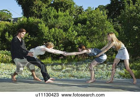 Stock Image - Young adults playing. Fotosearch