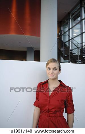 Young businesswoman in red dress View Large Photo Image Stock Photo - Young businesswoman in red dress. Fotosearch