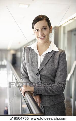 Young businesswoman smiling, portrait View Large Photo Image Stock Photography - Young businesswoman smiling, portrait. Fotosearch