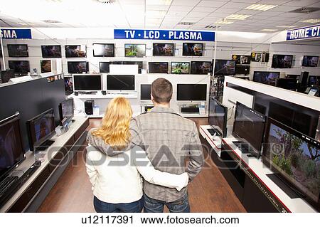 Young Couple in TV section View Large Photo Image Stock Image - Young Couple in TV section. Fotosearch