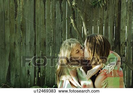 Stock Image - Young couple kissing. Fotosearch